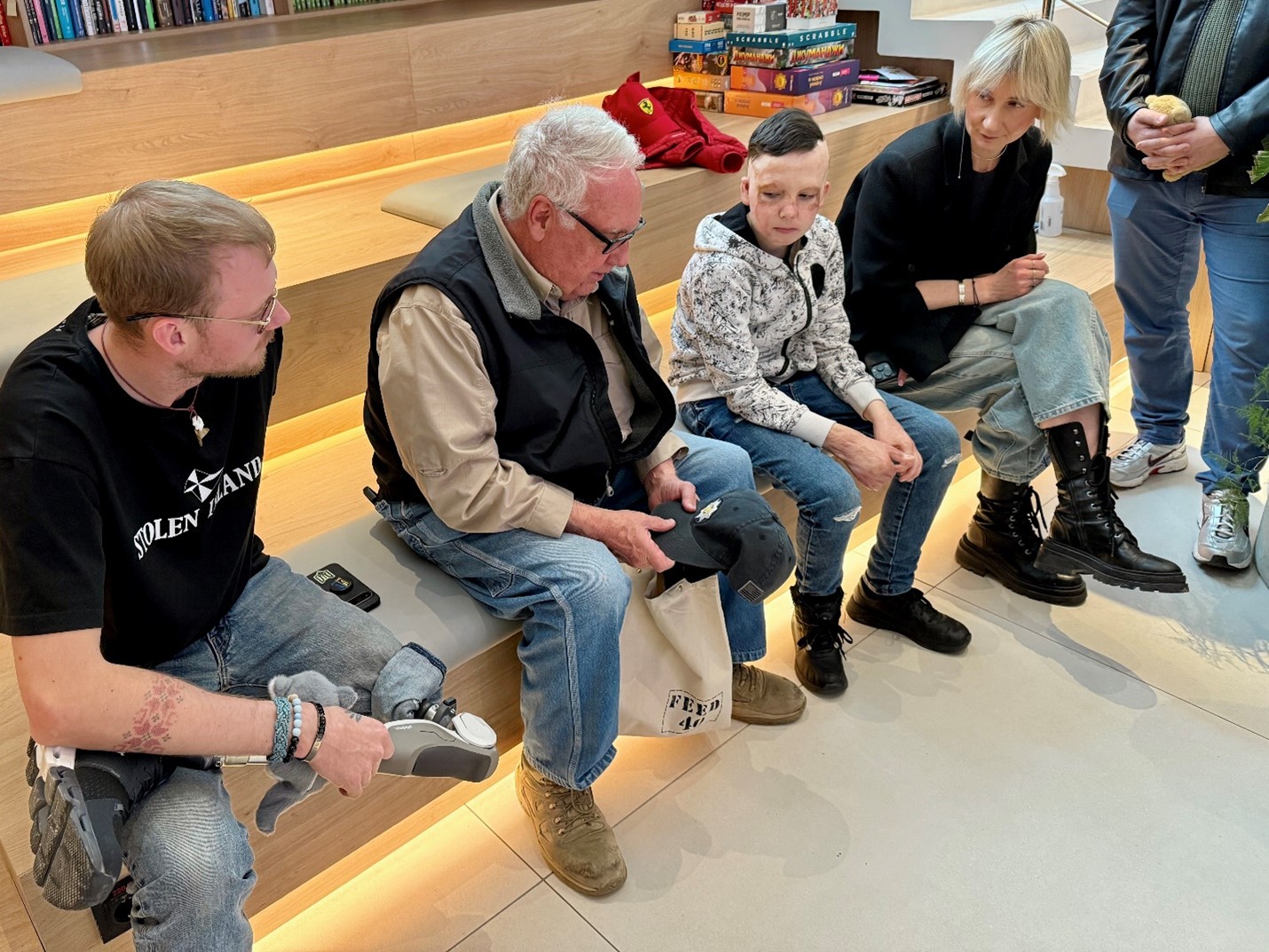 Buffett and our guide, Olga, visit with patients at the Superhumans clinic.