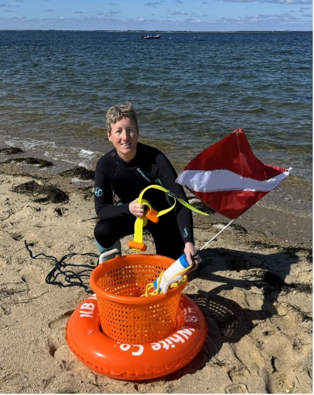 Chief Kasper diving for scallops.